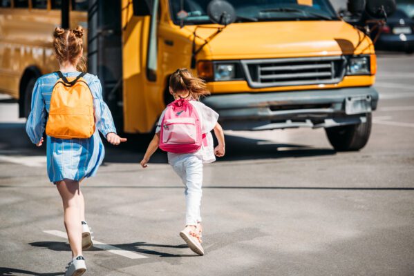 Warum GPS-Tracker für Schulranzen so wichtig sind rear view of schoolgirls with backpacks running to 2022 12 16 21 05 24 utc 599x400 - Warum GPS-Tracker für Schulranzen so wichtig sind